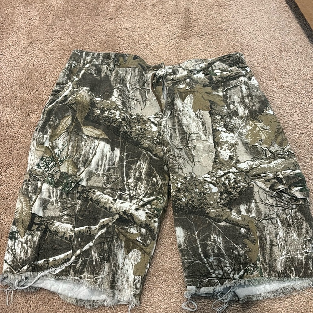 Camo cargo shorts, size 10-12 material unknown it is very thin